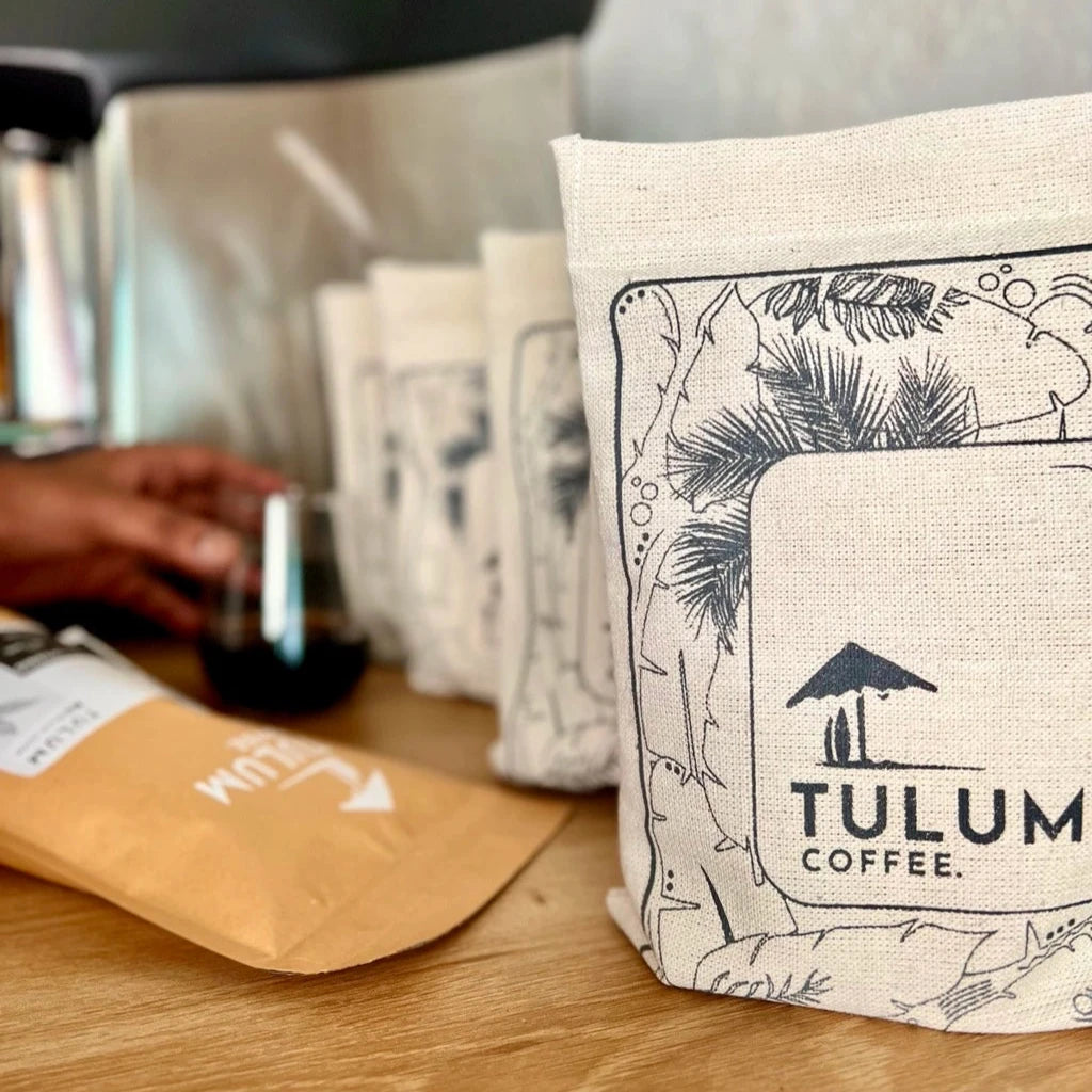 Pulneys 100% Organic And Arabica Coffee Beans by Tulum Coffee in a grey cloth bag with dark and Fruity notes.